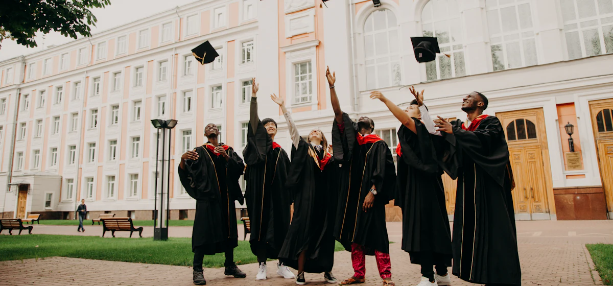 Graduates throwing their caps in the air