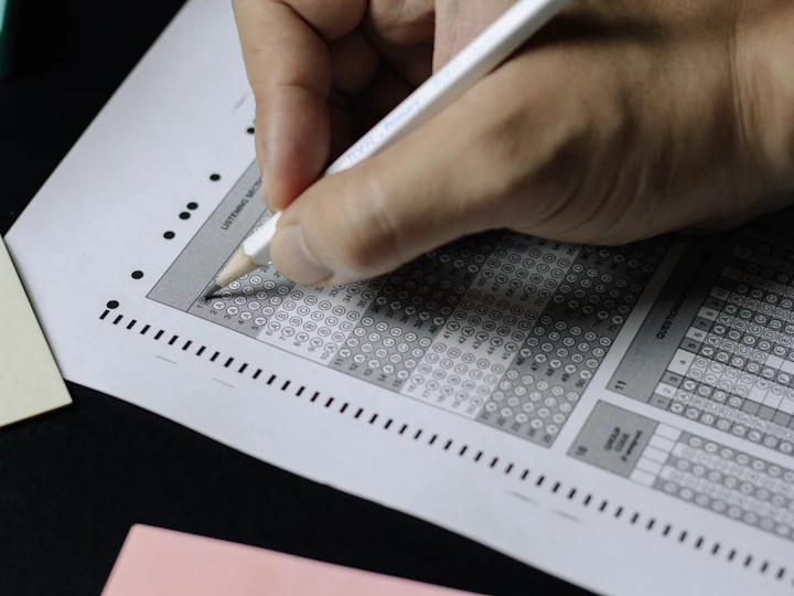 A candidate filling in an answer sheet